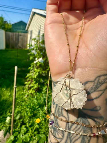 quartz stalactite slice in gold