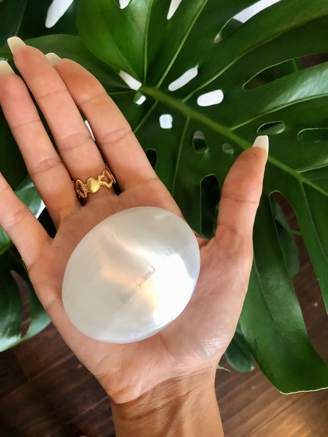 selenite crystal palm stone