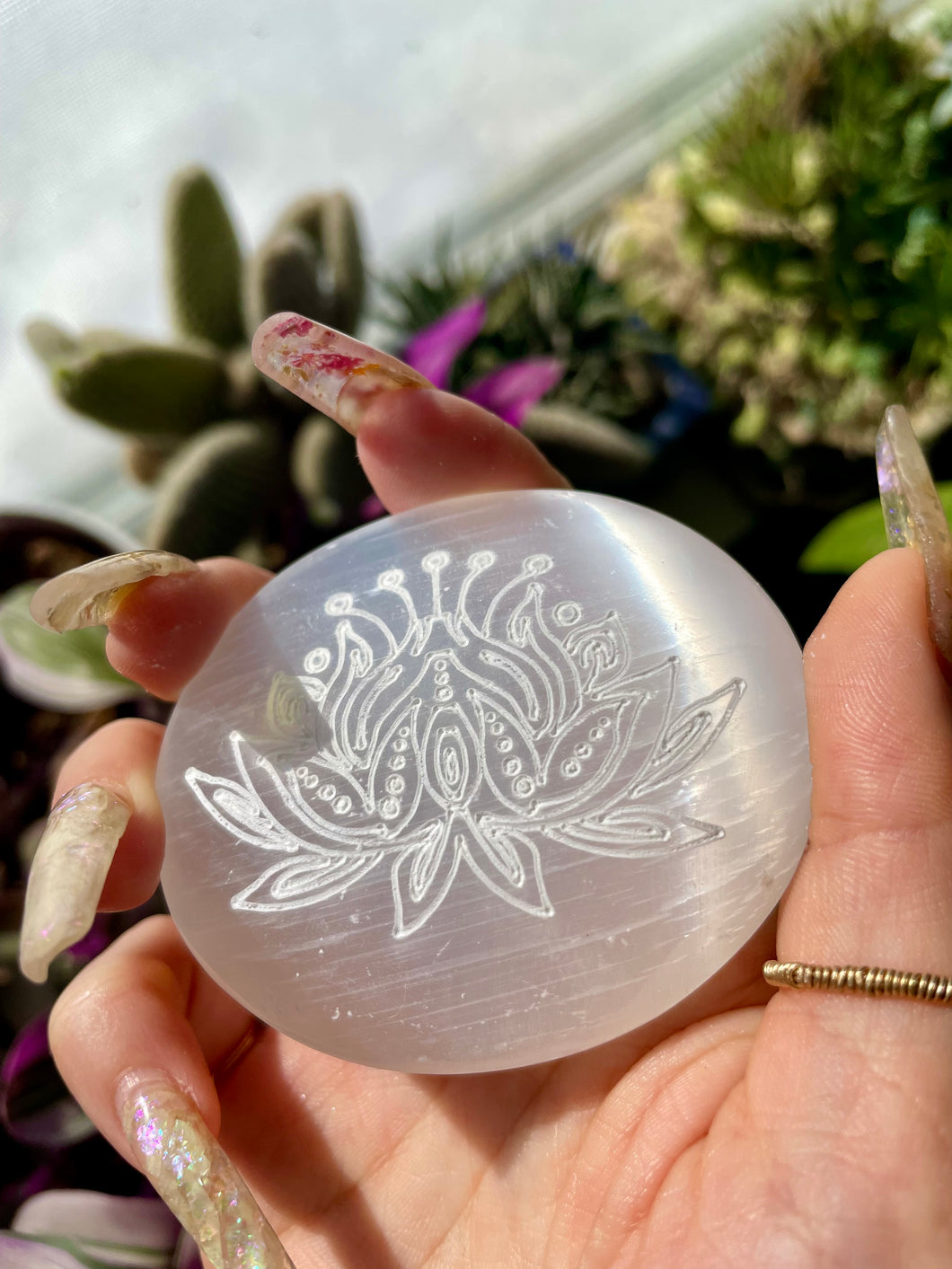 engraved lotus selenite palm stone